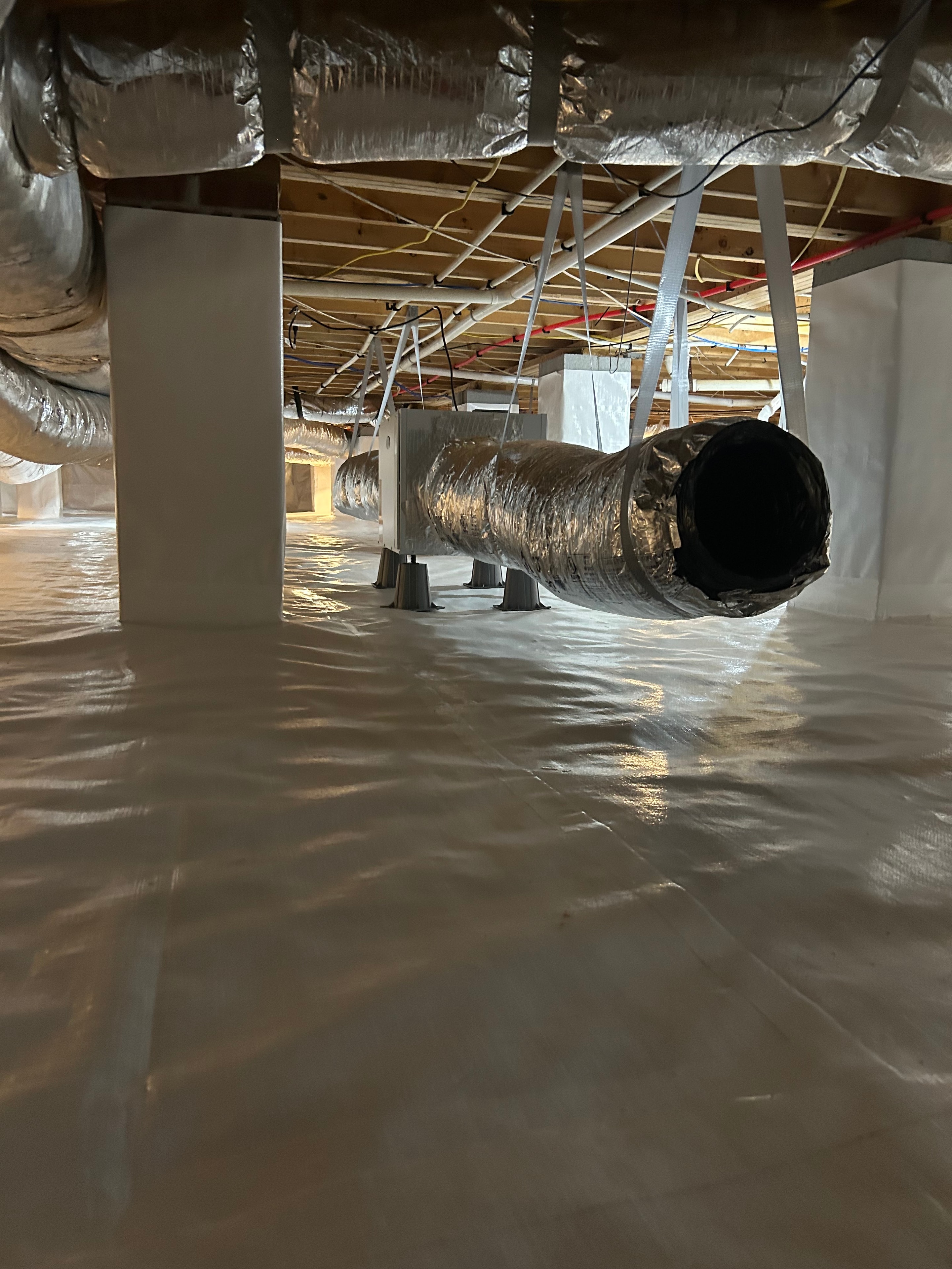 Crawl space ductwork and vapor barrier