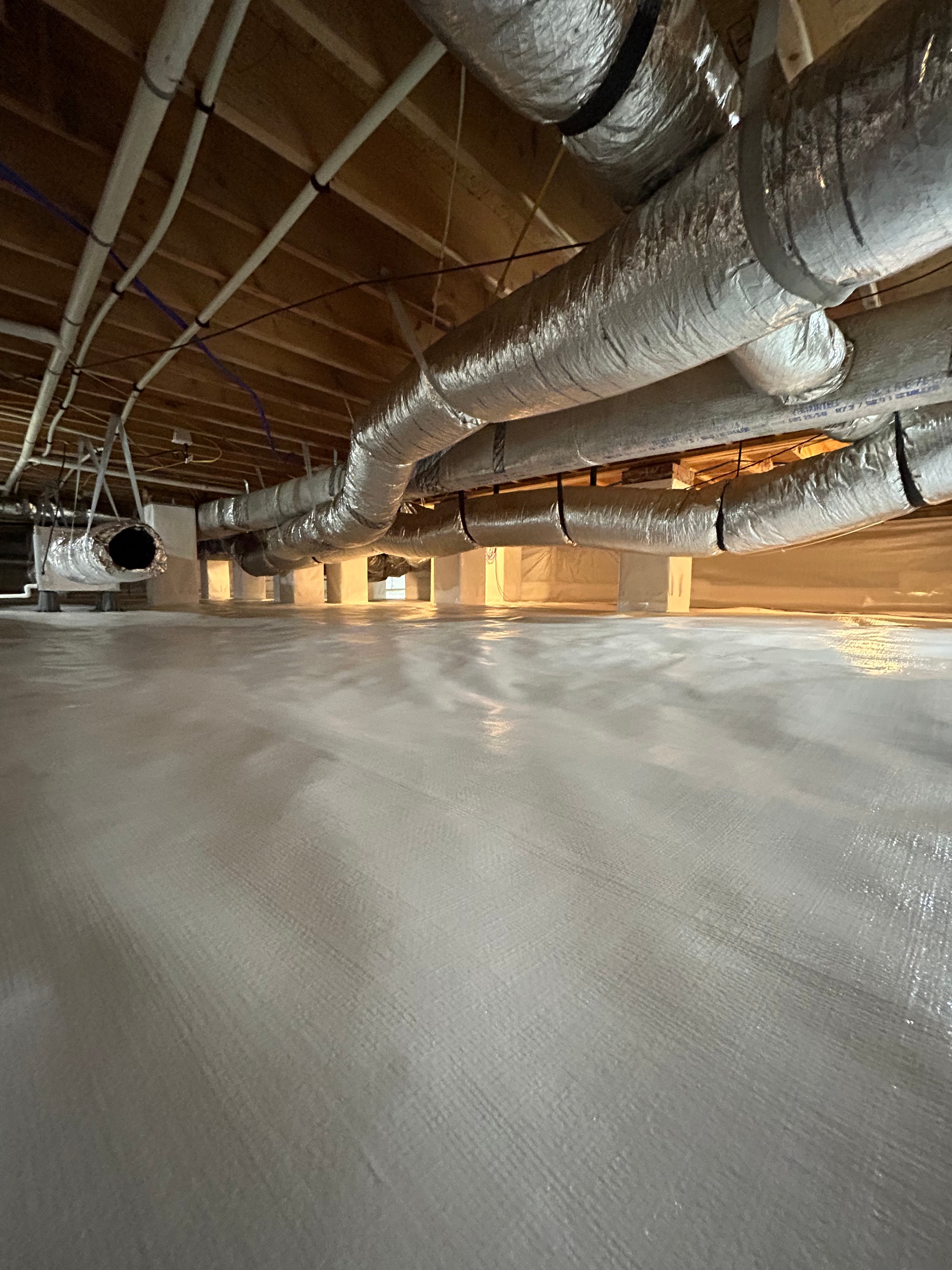 Crawl space with insulated ductwork and piping
